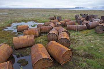 Gas cans rusted in a river - Chukotka Russia