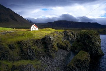 Typical small house on the coast of Iceland in Arnarstapi