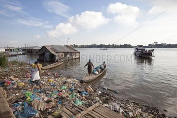 Boat loaded with supplies and trash Tonle sap Cambodia
