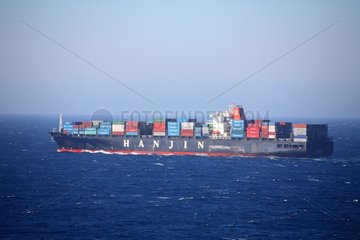 Container ships sailing in open sea