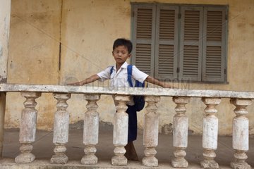 Schoolboy on his way to school in Cambodia