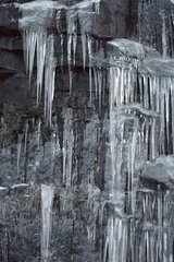 Ice stalactites on rocks in Quebec Canada