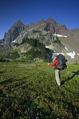 Backpacker at the base of Three Fingered Jack USA
