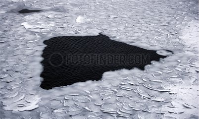 Hole in the drifting ice of Baffin Bay Canada