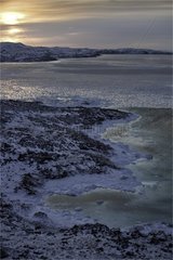 Shore and sea ice of Frobisher Bay on Baffin Island Canada