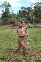 Dancing boy with bow and penis sheath Papua New-Guinea