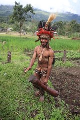 Man with penis sheath and drum Papua New-Guinea