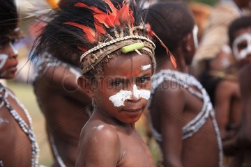 Boy with feather headdress and paint Papua New-Guinea