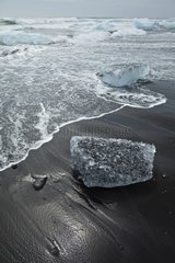 Lake ice breaking on the beach Joekulsárlón Iceland