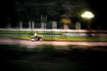 Motorcycle passing in front of the royal palace - Thailand