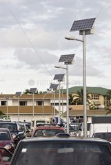 Solar-powered streetlights in a parking lot Noumea