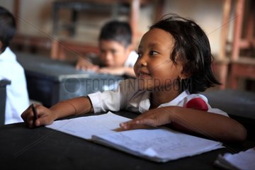 Schoolgirl listening in class Gangga Lombok Indonesia