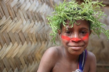 Boy with cap and paint Papua New-Guinea