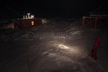 Researcher in the polar night Antarctic Concordia Station