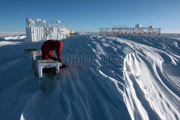 Glaciologist taking samples Concordia Antarctic