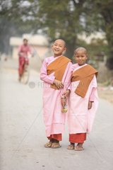 Buddhist nuns in the street laughing Burma