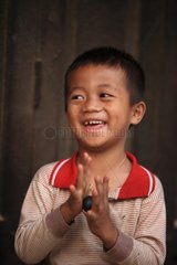 Child playing with a big ball Namshan Burma