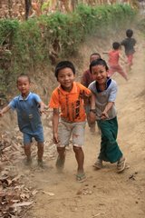 Children playing in a dirt road in Burma