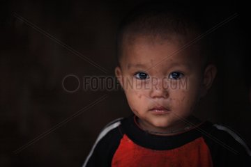 Portrait of a young boy in a village in Burma