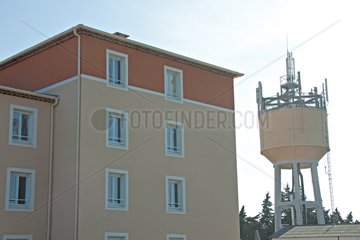 Antenna on a water tower located near homes France