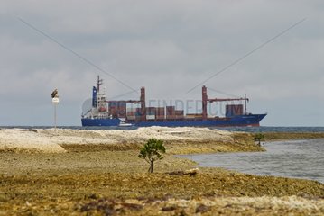 Container ship sailing in the lagoon New Caledonia