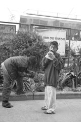 Boys sniffing glue in the streets Kathmandu Nepal