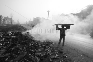 Man and tipping on fire Kathmandu Nepal