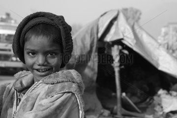 Portrait of boy street outside his tent Kathmandu Nepal