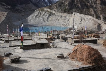 Masts prayer and haystack Manang Nepal Himalayas