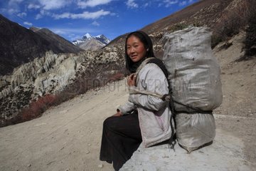 Portrait of a young girl carrying Gunsang Nepal Himalayas