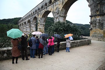 Japanese tourists photographing the Pont du Gard France