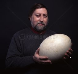 Man carrying an Elephant bird Egg
