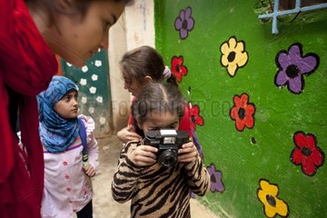 Girl in a Shatila class photographing his world - Lebanon