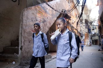 Students eating in the streets of Shatila Camp - Lebanon