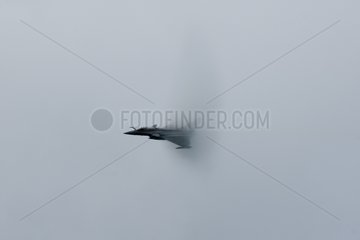 Plane crossing the sound barrier