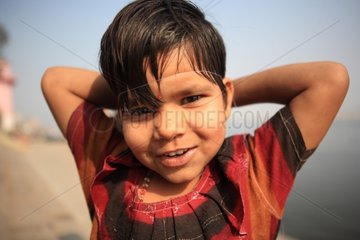 Portrait of young girl playing with a string Varanasi India