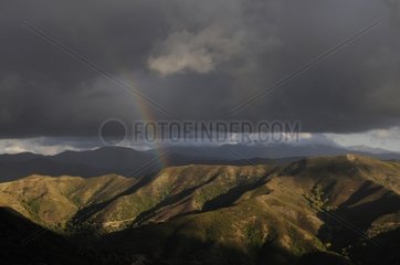 Rainbow and stormy sky in the mountains of Crete