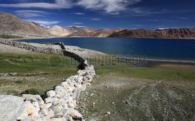 Wall on the banks of Lake Pangong Ladakh Himalayas India