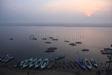 Boats on the Ganges at sunrise Varanasi India
