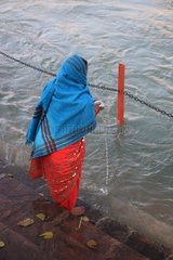 Women in saris on the banks of the Ganges Haridwar India