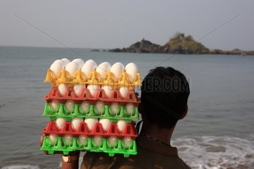 Seller of eggs on the beach Gokarna India