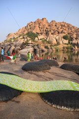 Towel drying on boats round Vijayanagara Hampi India