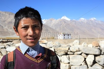 Schoolboy in uniform Pipiting Zanskar Ladakh Himalayas India