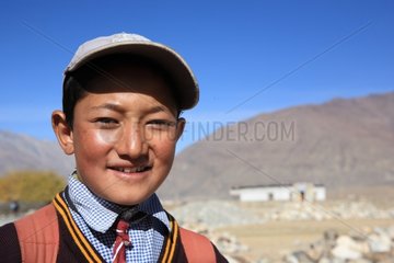 Schoolboy in uniform Pipiting Zanskar Ladakh Himalayas India