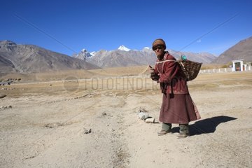 Man carrying a load Zanskar Ladakh Himalayas India