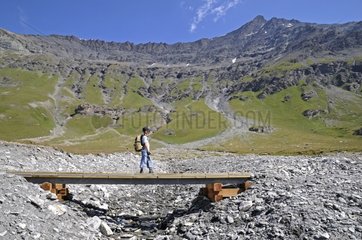 Boy on a bridge massif Sassière Alps France