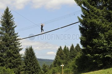 Woman on a tree climbing Jura France