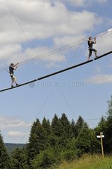Man and Woman on a tree climbing Jura France