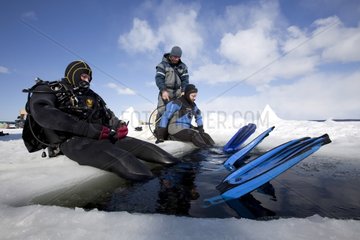 Scuba diving under the iceWhite Sea Karelia Russia