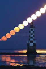 Moonrise over the lighthouse Partridge - France